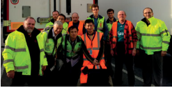 ESA logistika employees in protection yellow or orange vest