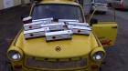 Yellow trabant with 8 ESA logistika paper trucks